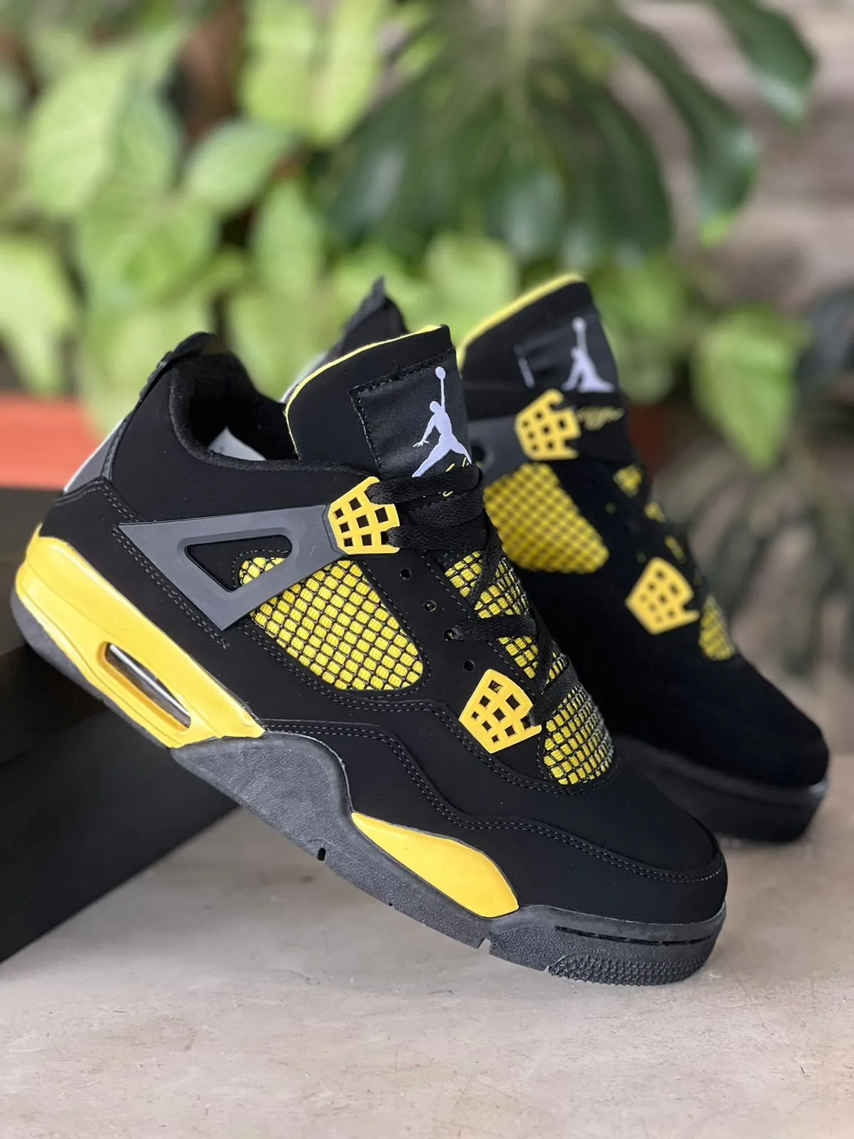 Nike Air Jordan 4 Retro Sneakers "Black and Yellow"